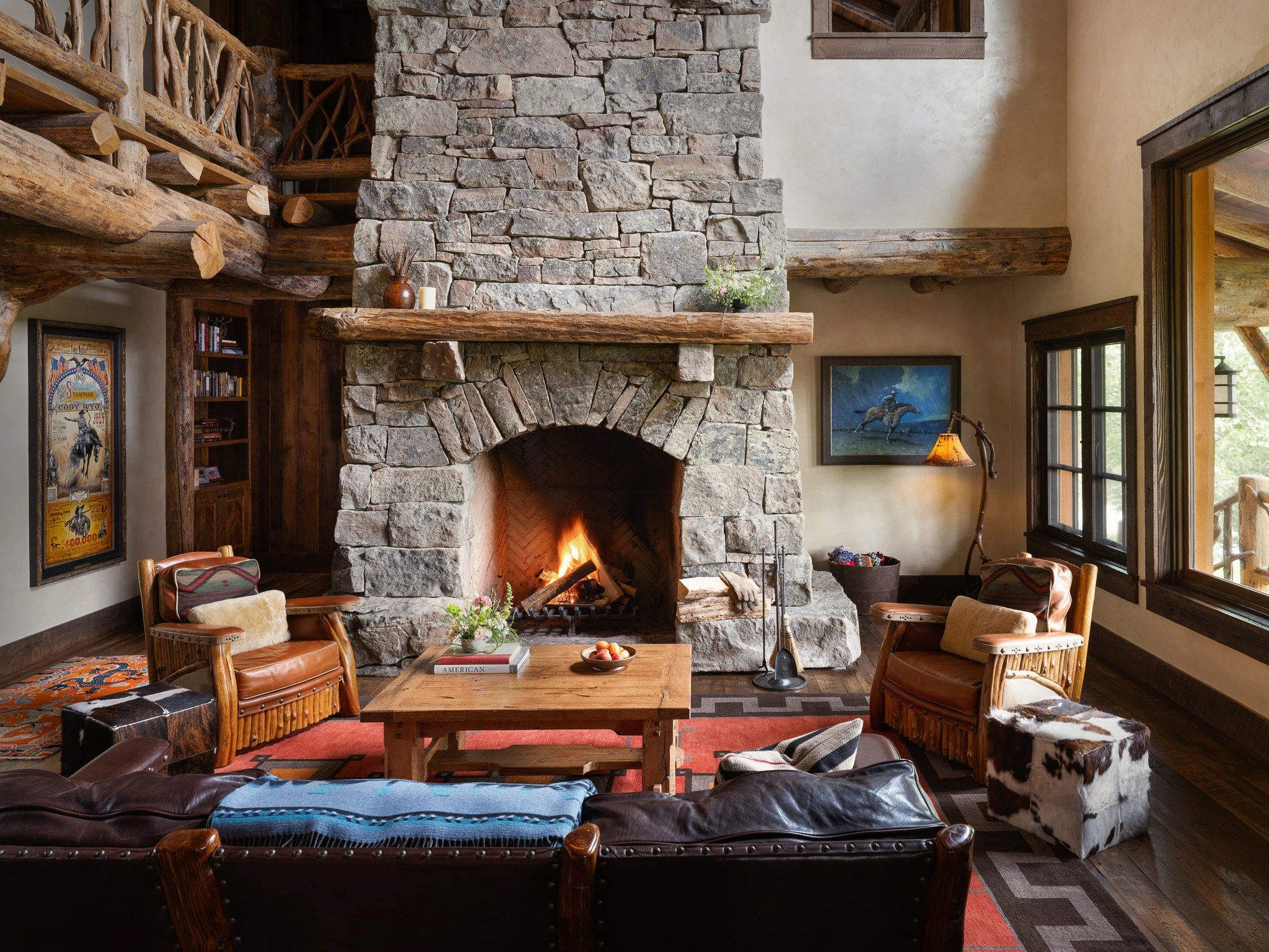 Great room stone fireplace and log loft — architectural photography Big Sky Montana, Club Ridge